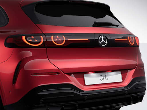 Dominant rear end with broad wheel arches and flush design.