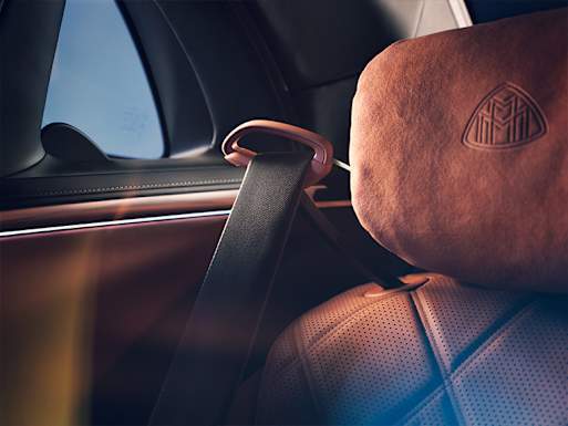 Seat belt feeders in the rear